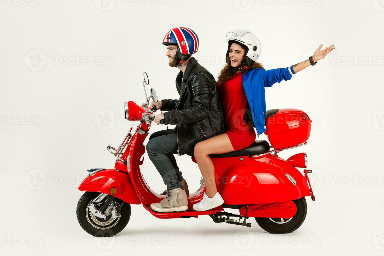 young attractive couple riding an electric motorbike scooter happy having fun together photo