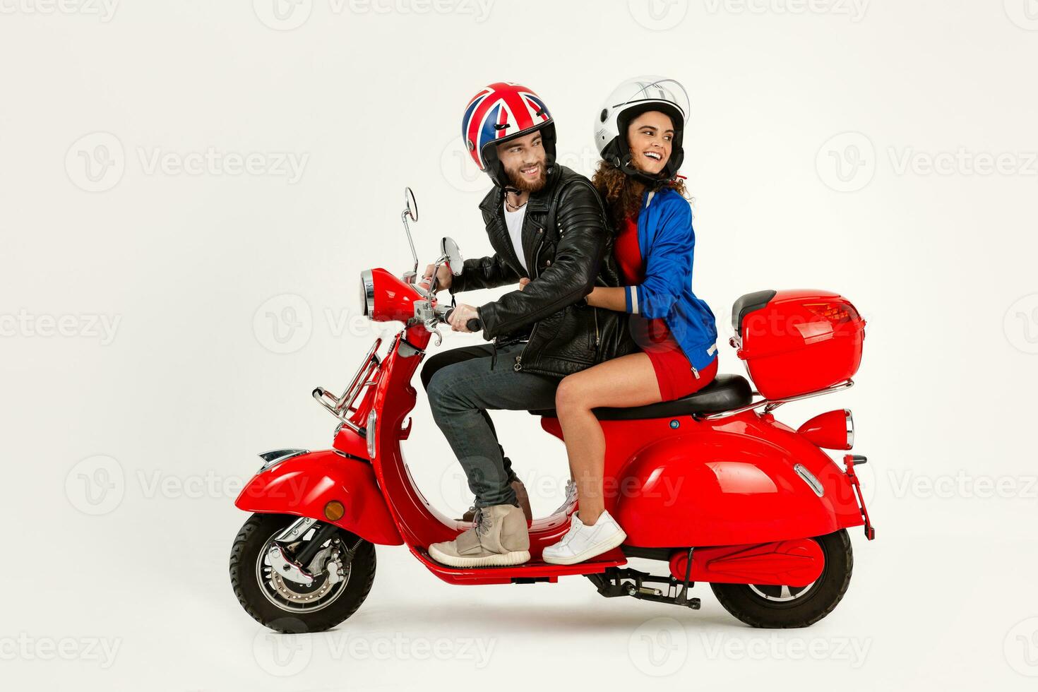 young attractive couple riding an electric motorbike scooter happy having fun together photo