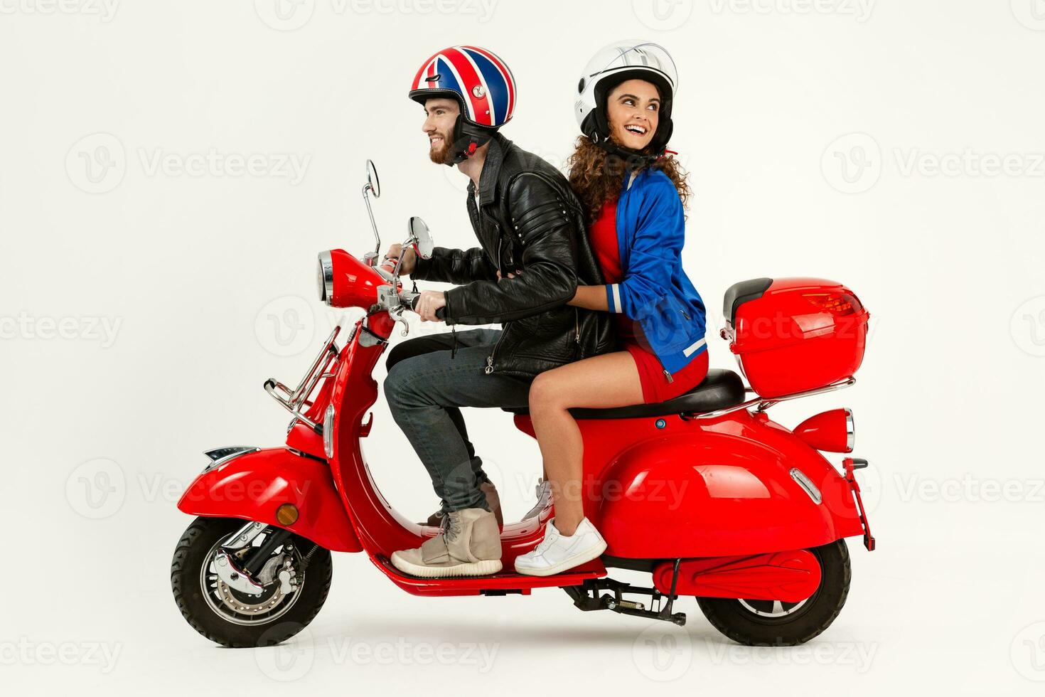 young attractive couple riding an electric motorbike scooter happy having fun together photo