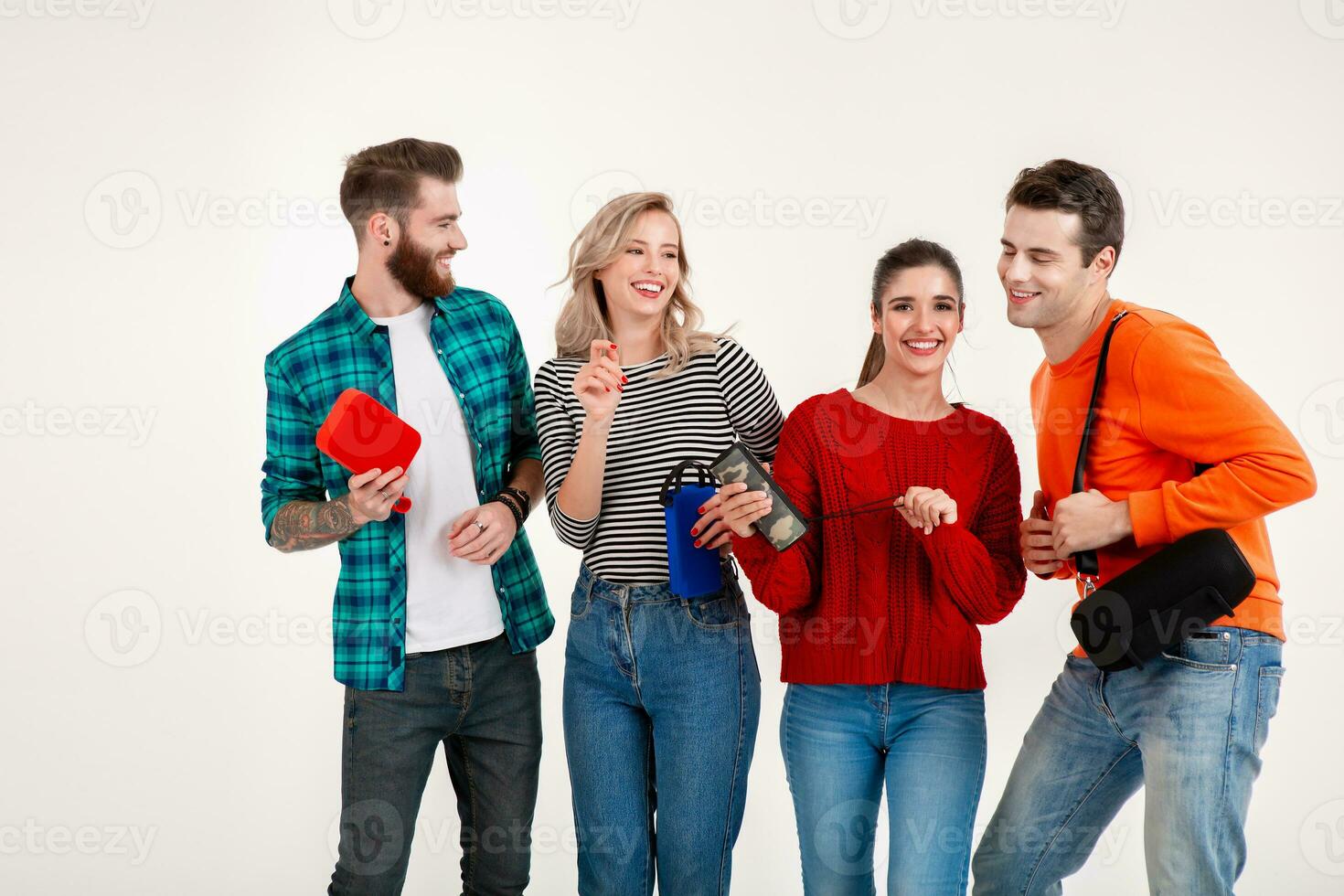 company of friends having fun together listening to music photo