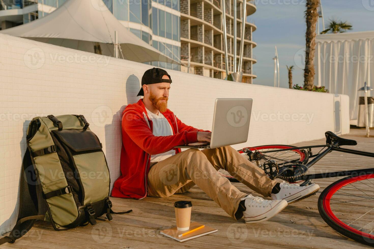 handsome bearded man traveling with bicycle in morning photo