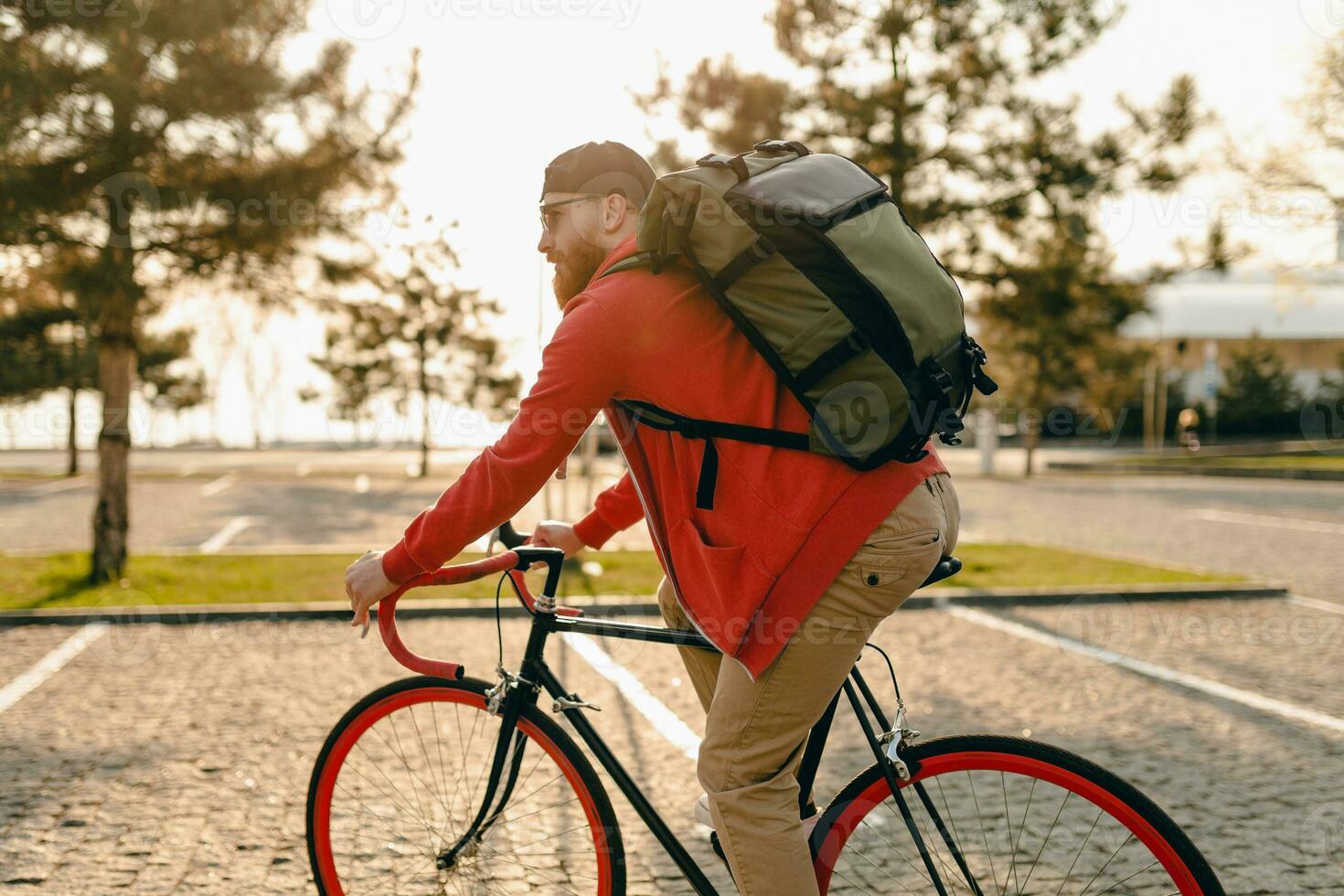 handsome bearded man traveling with bicycle in morning photo