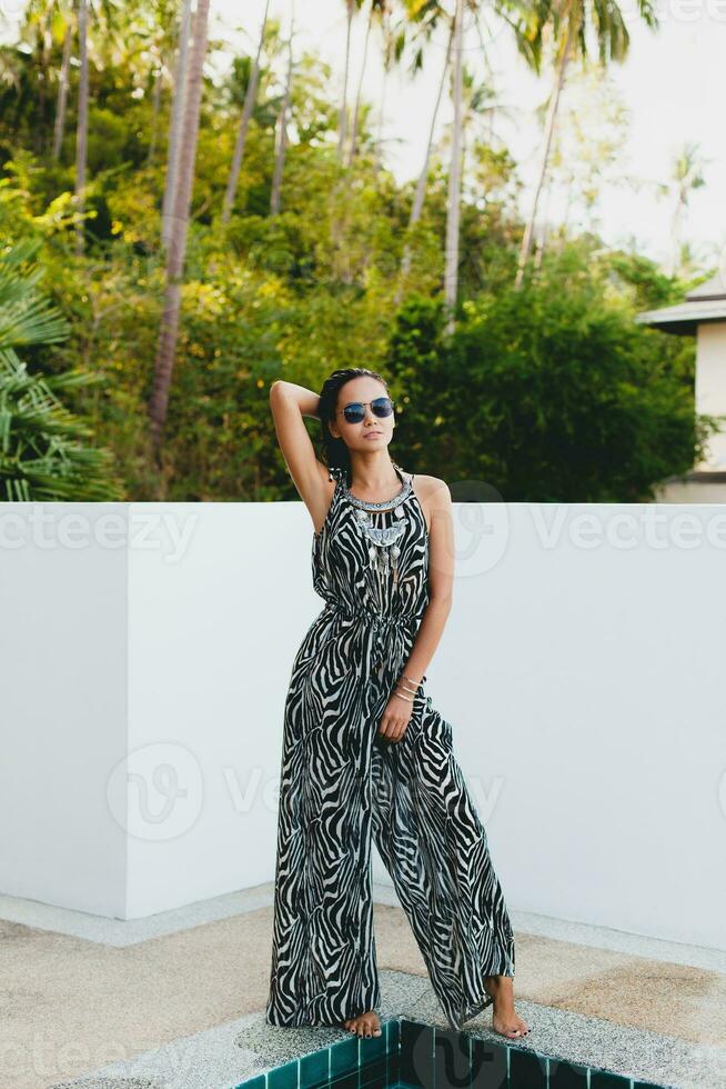 young asian sexy beautiful woman in tropical dress, zebra print photo