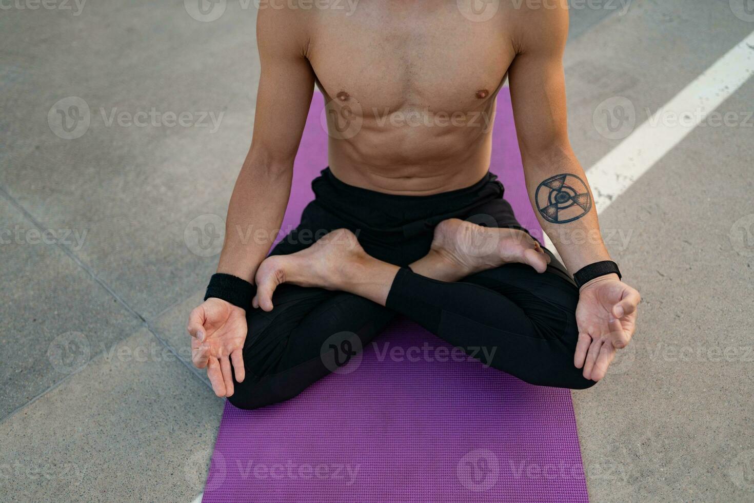 attractive hansome man with athletic strong body doing morning yoga dzen meditation photo