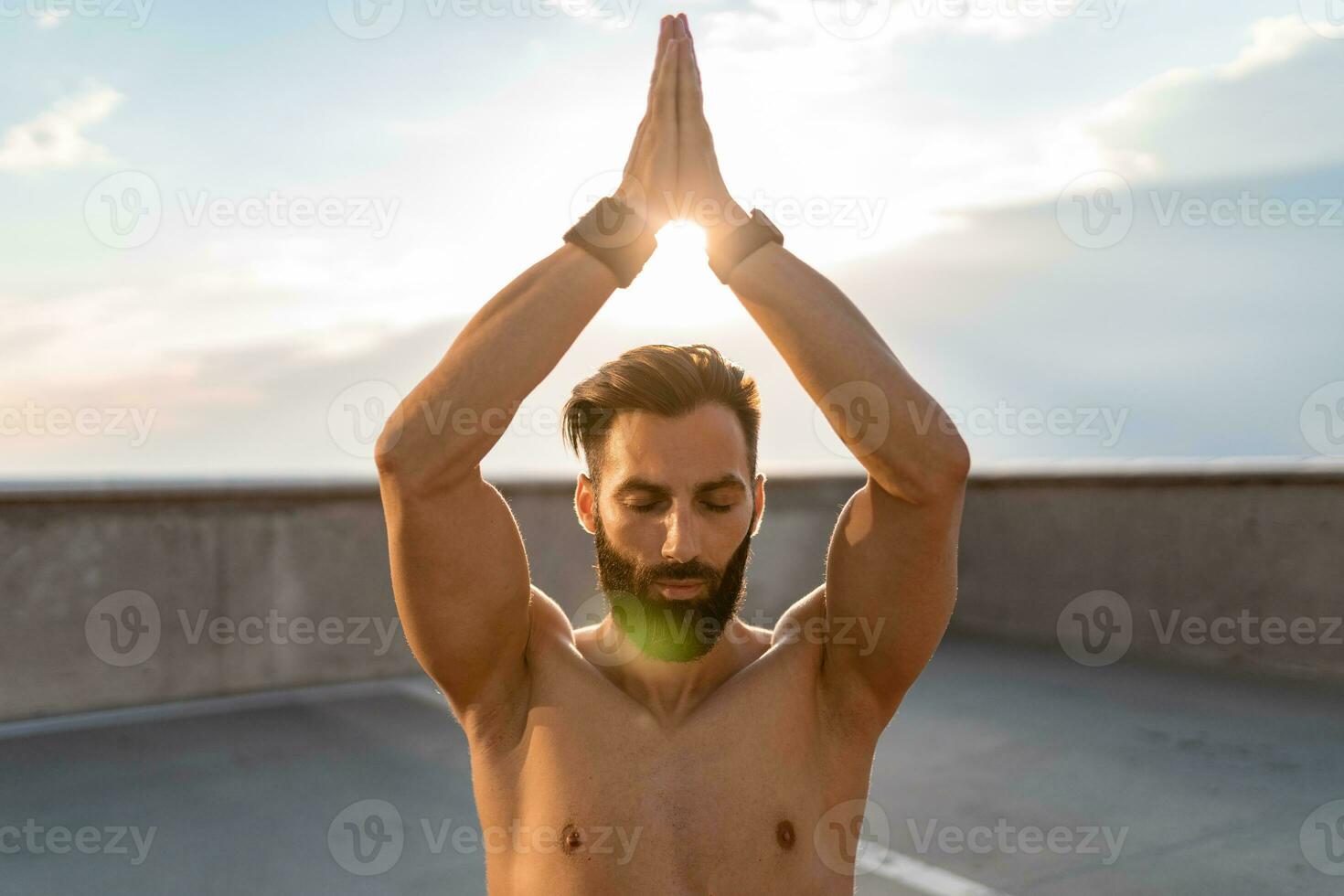 attractive hansome man with athletic strong body doing morning yoga dzen meditation photo