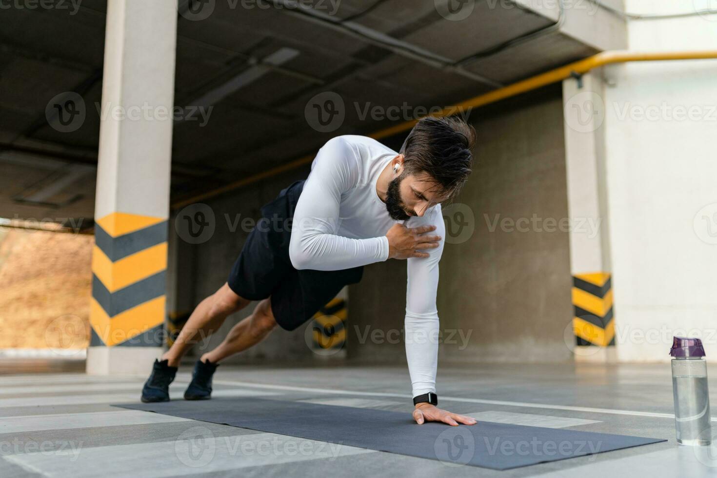 athletic strong hansome man on morning fitness workout exercise photo