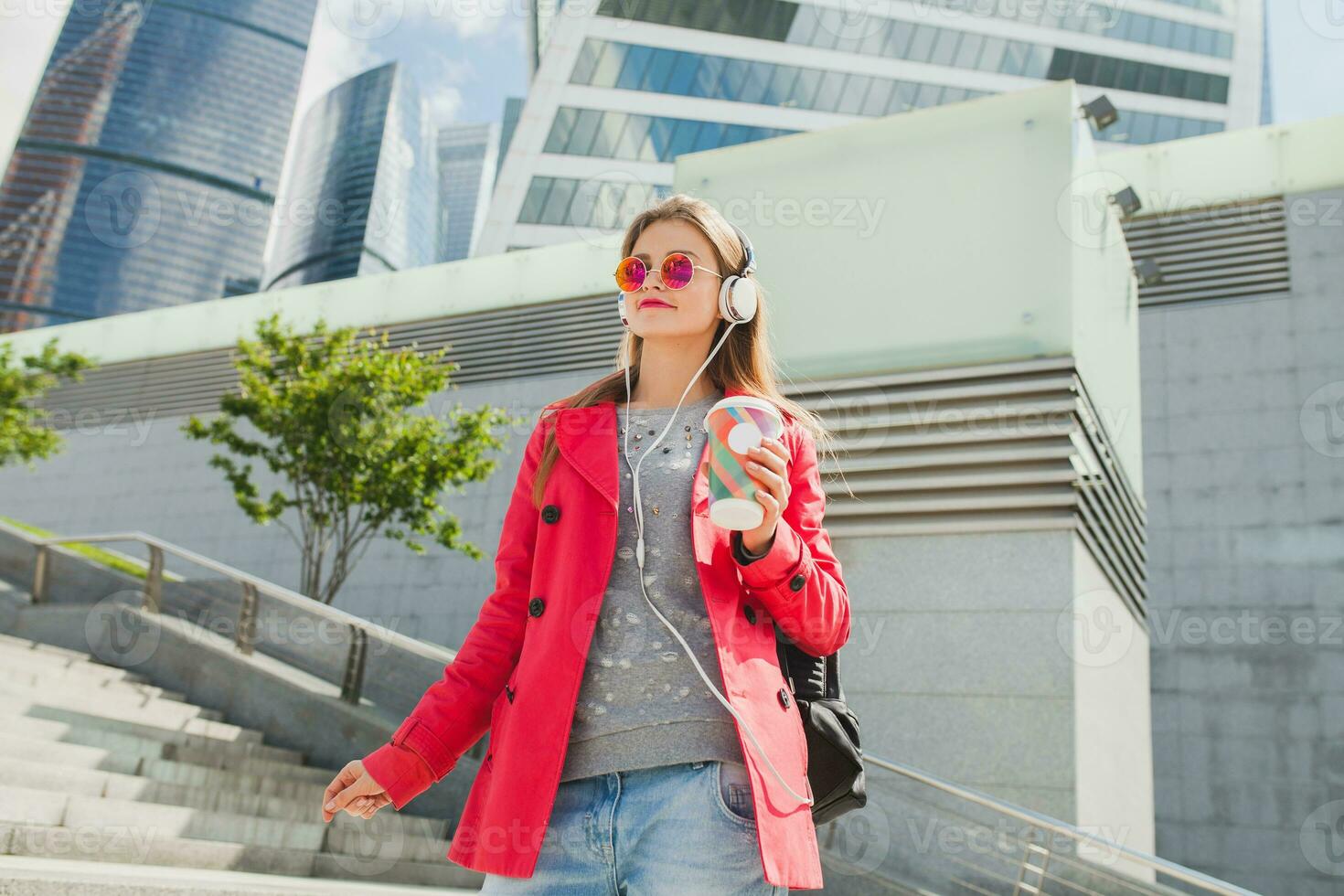young hipster woman in pink coat photo