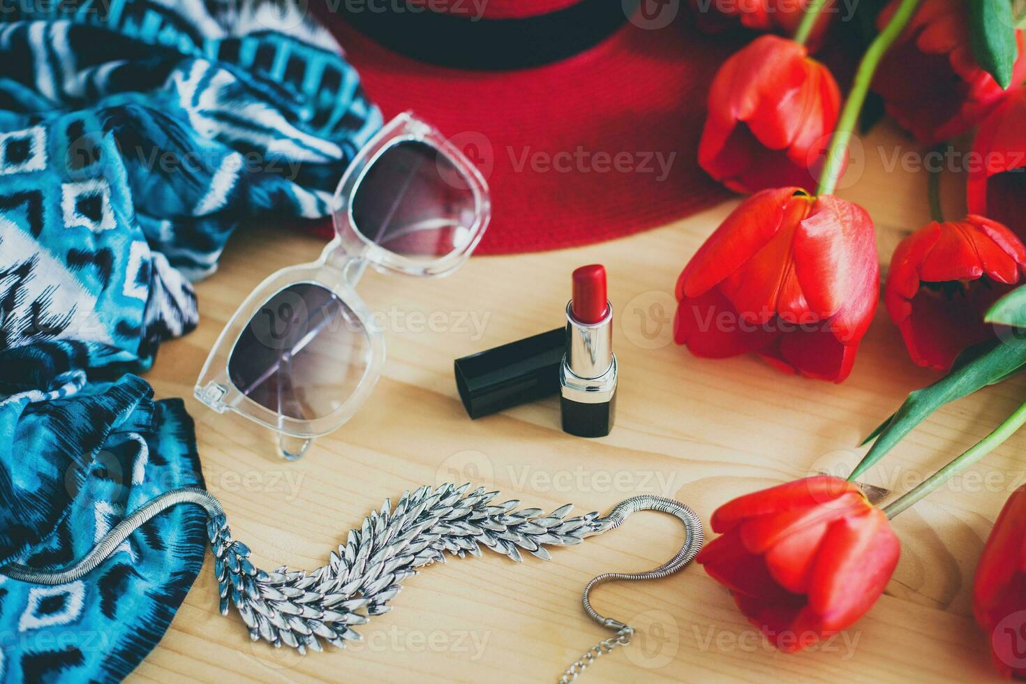 woman's accessories flat lay with red tulips photo