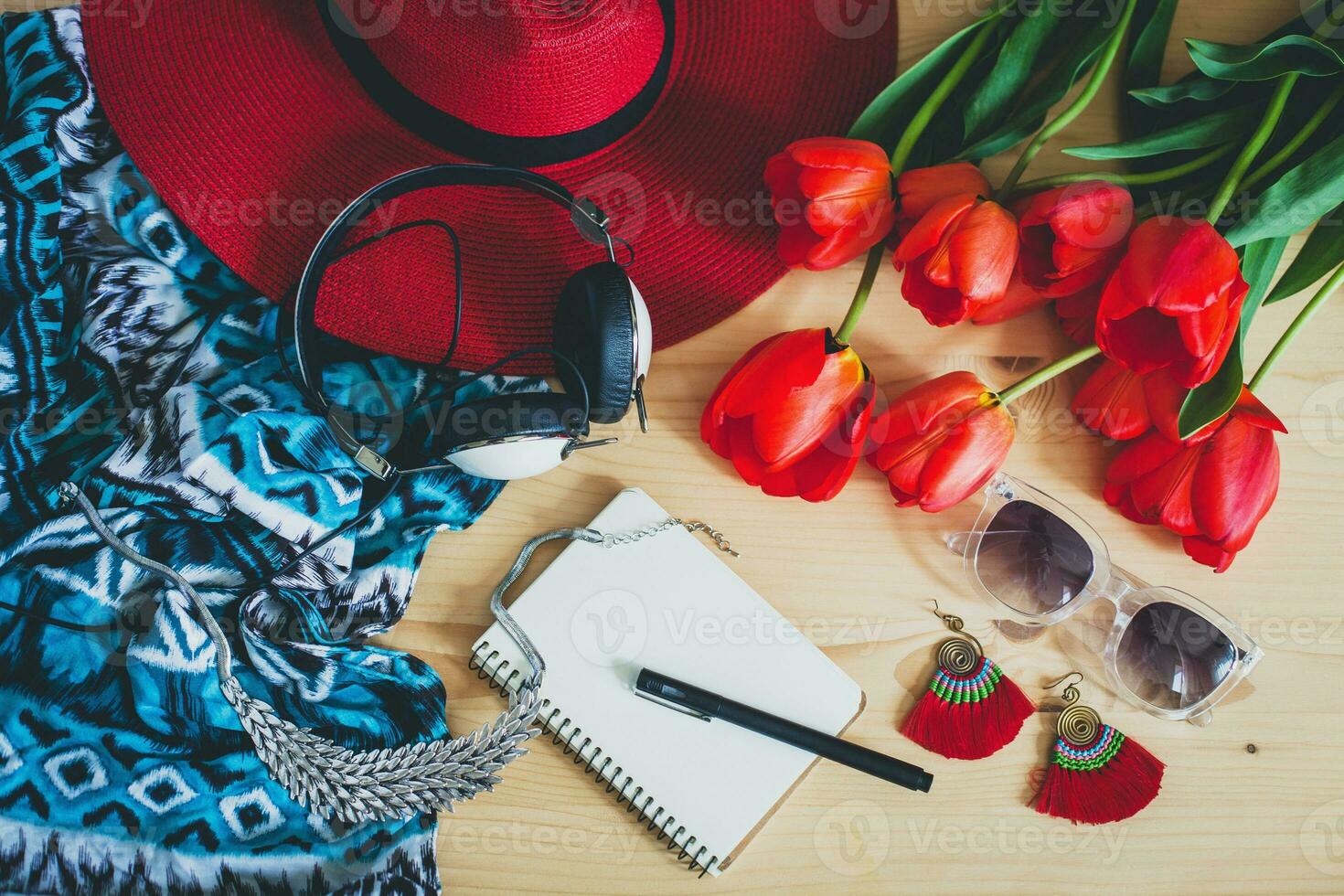 woman's accessories flat lay with red tulips photo