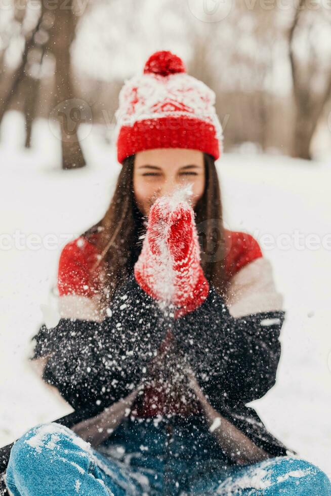smiling woman having fun in winter park photo