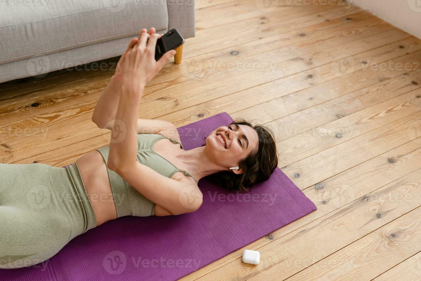 young pretty woman doing yoga at home photo