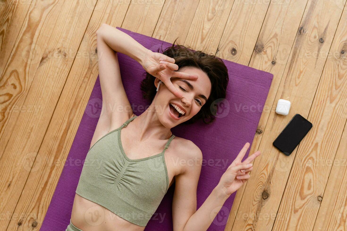 young pretty woman doing yoga at home photo