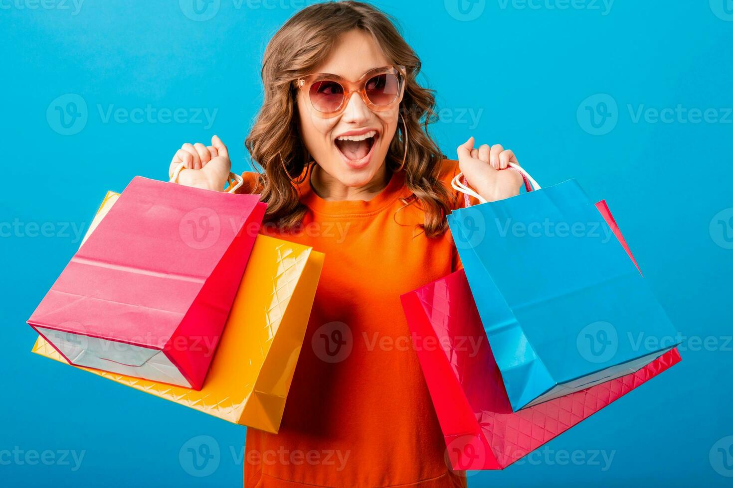 attractive happy smiling stylish woman holding shopping bags photo