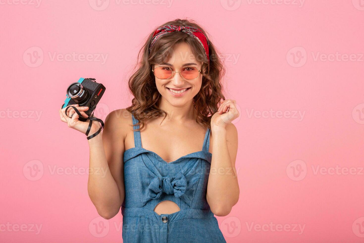 attractive smiling happy woman posing with vintage photo camera