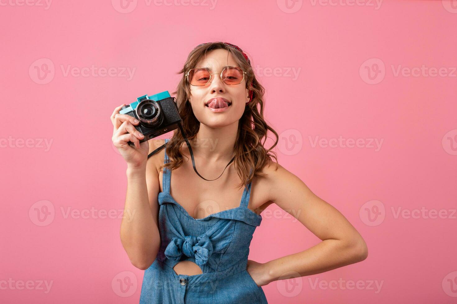 attractive smiling happy woman posing with vintage photo camera