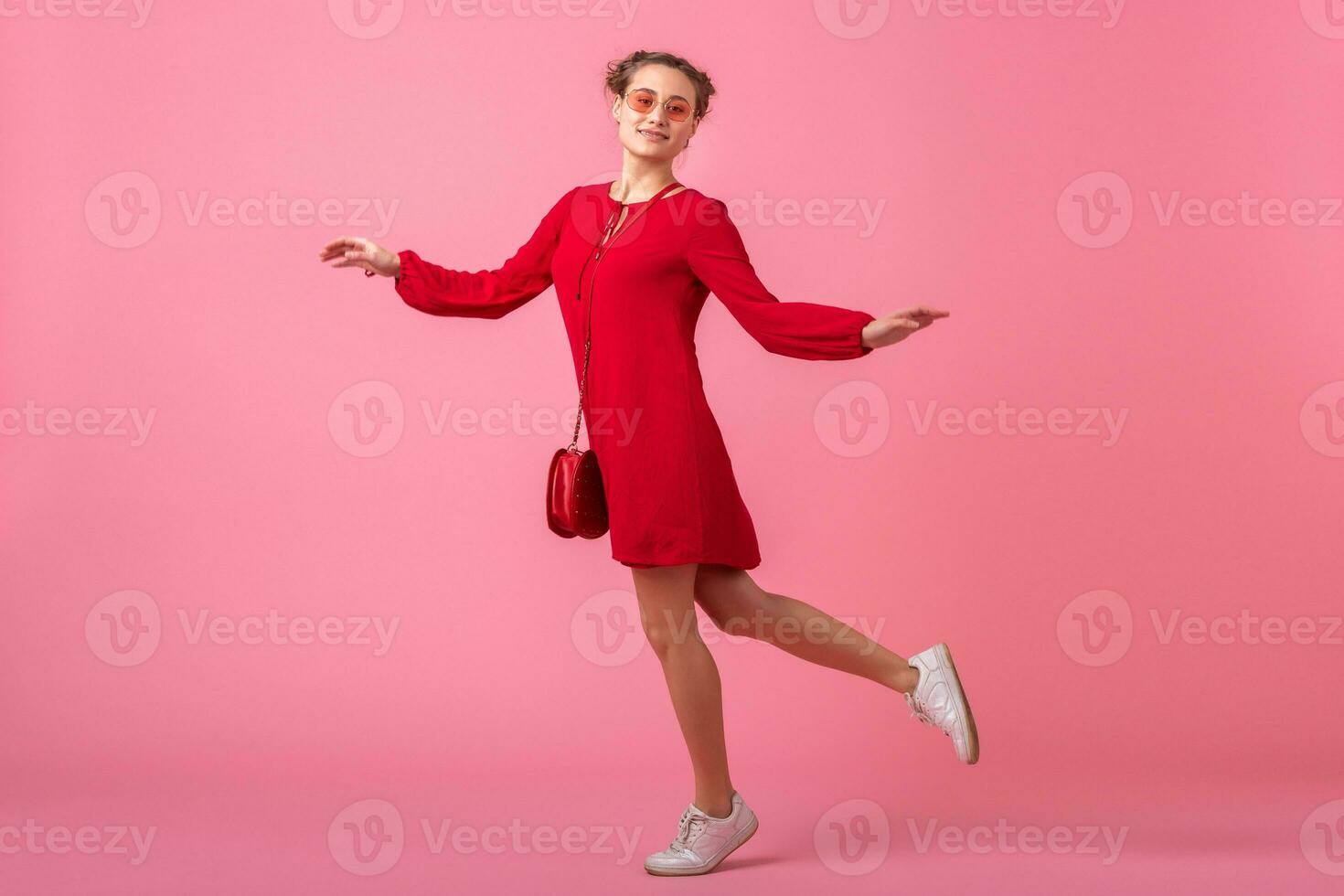 attractive happy smiling stylish woman in red trendy dress photo