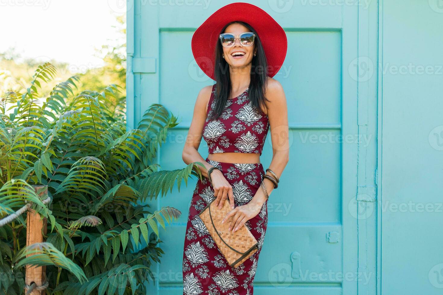 stylish beautiful woman in printed outfit, summer style fashion photo