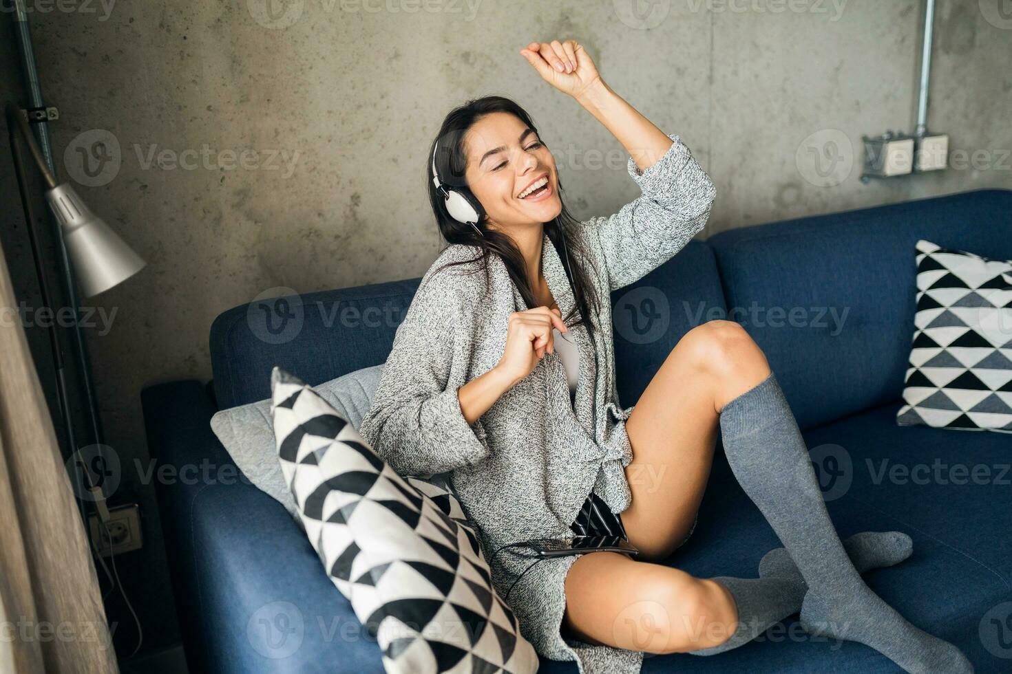 Beautiful woman in casual clothing, looking away, wearing futuristic  headphones generated by AI 28061856 Stock Photo at Vecteezy