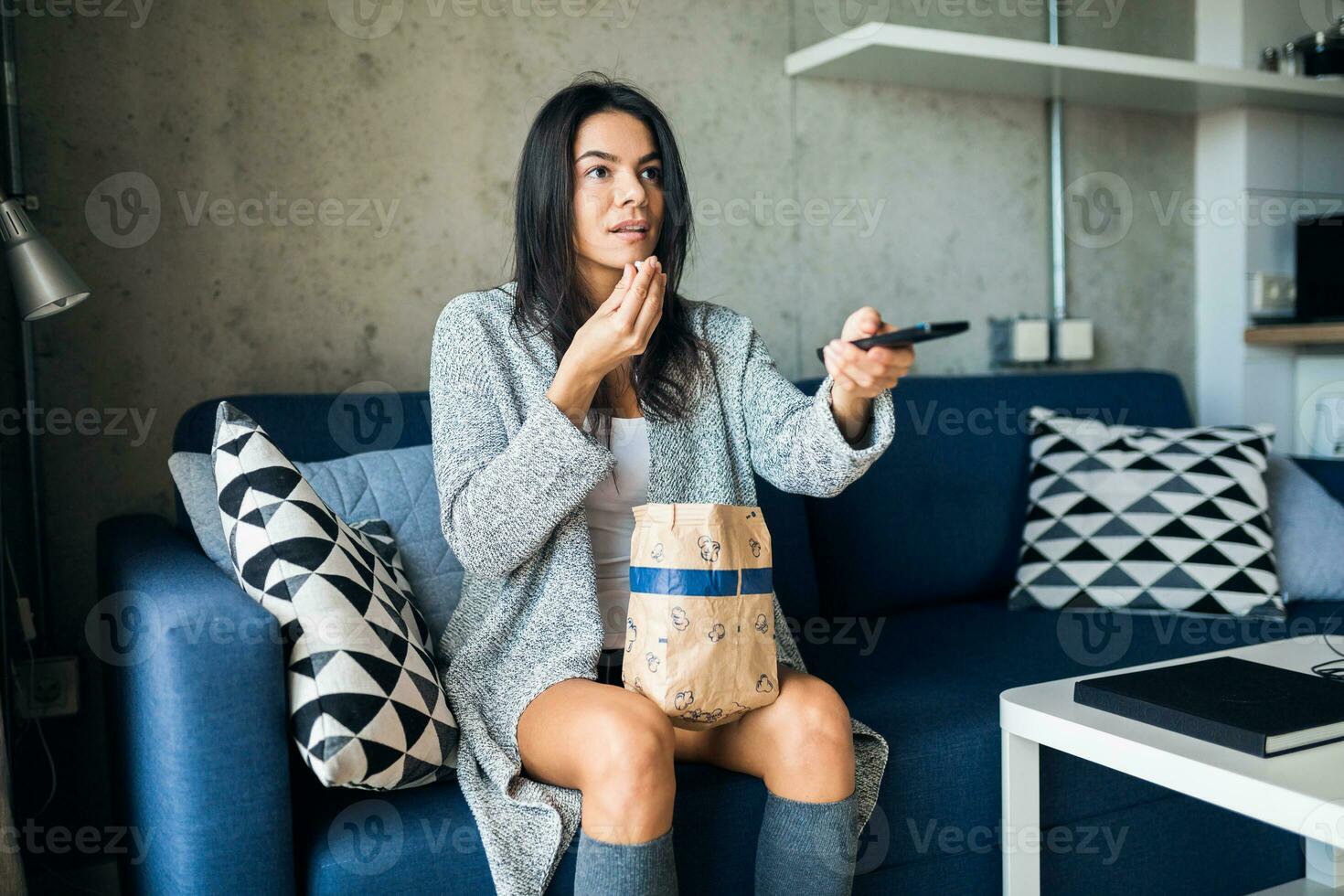 young attractive woman in casual outfit relaxing at home photo