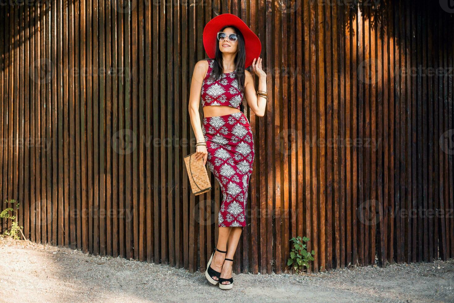 stylish beautiful woman in printed outfit, summer style fashion photo