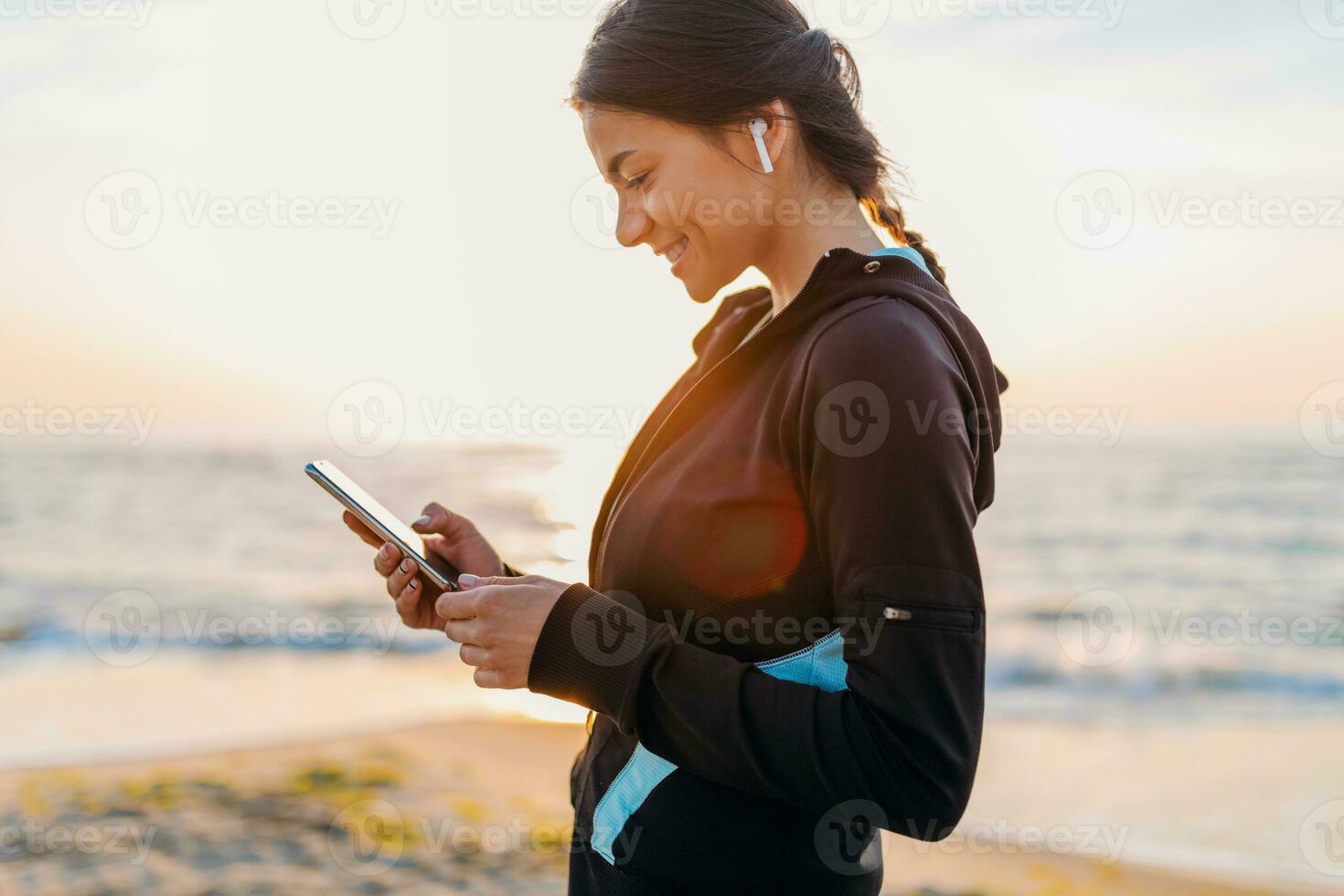 a woman in a sports bra and shorts is doing yoga on the beach 31417230  Stock Photo at Vecteezy