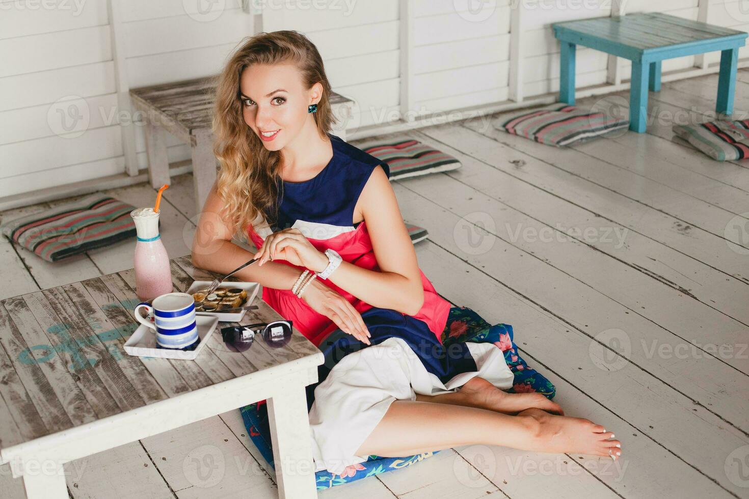 young stylish beautiful woman in cafe photo