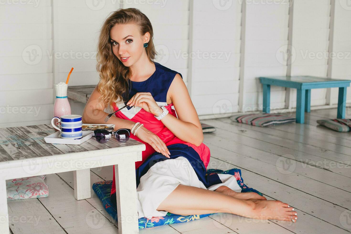 young stylish beautiful woman in cafe photo
