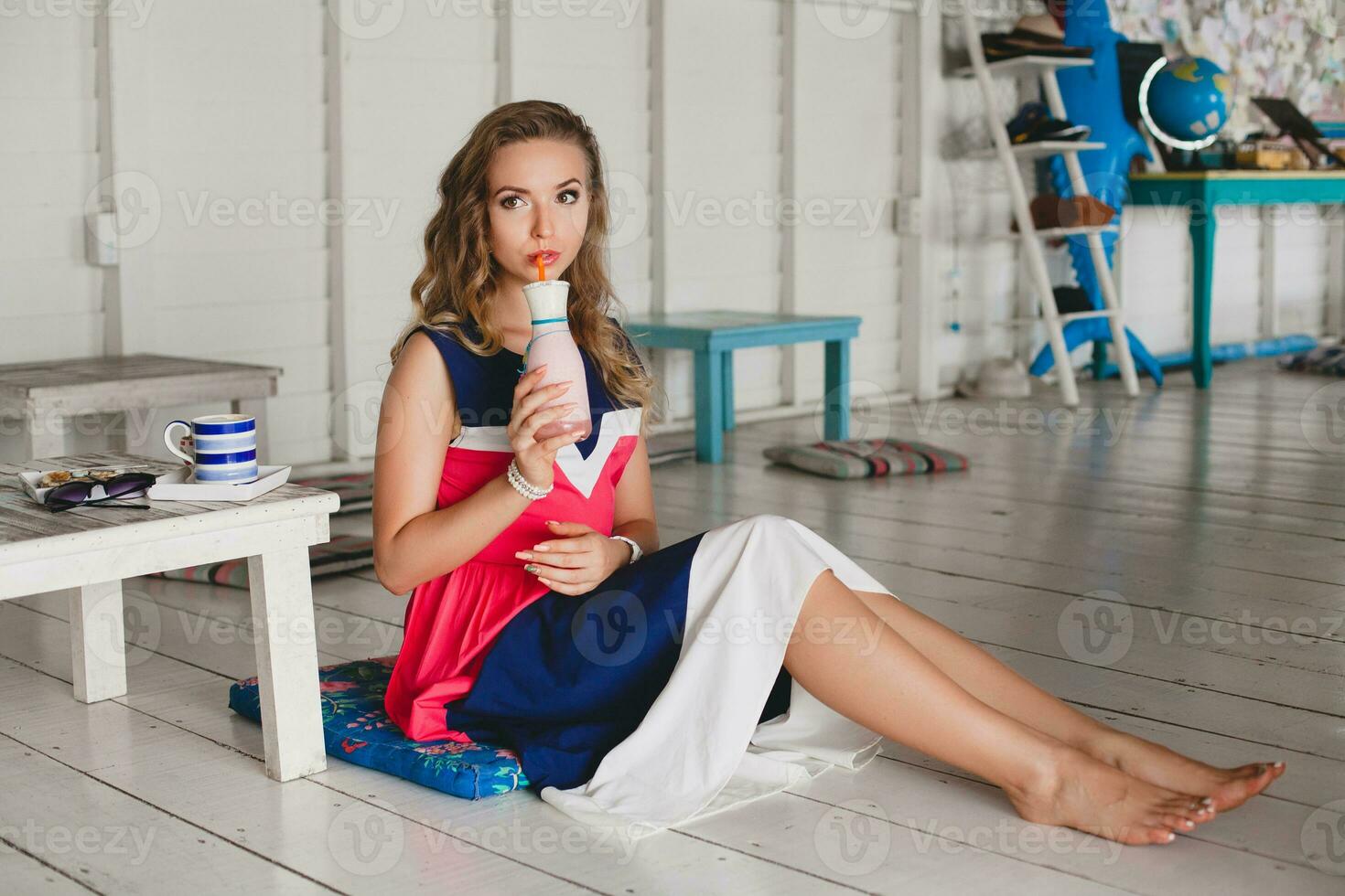 young stylish beautiful woman in cafe photo
