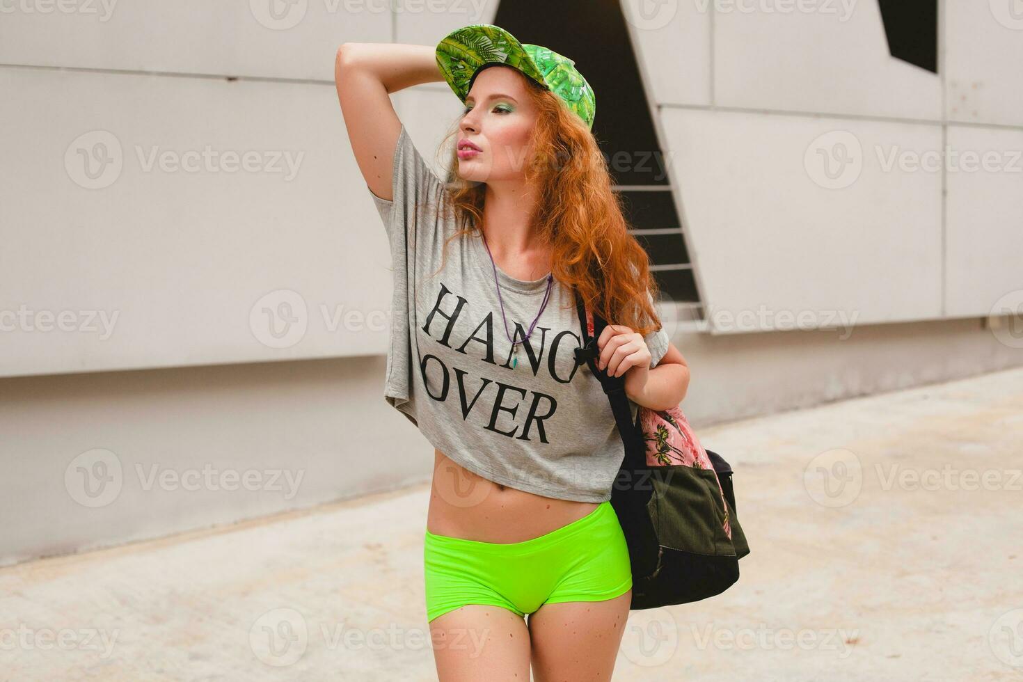 young stylish hipster ginger woman, walking in street photo