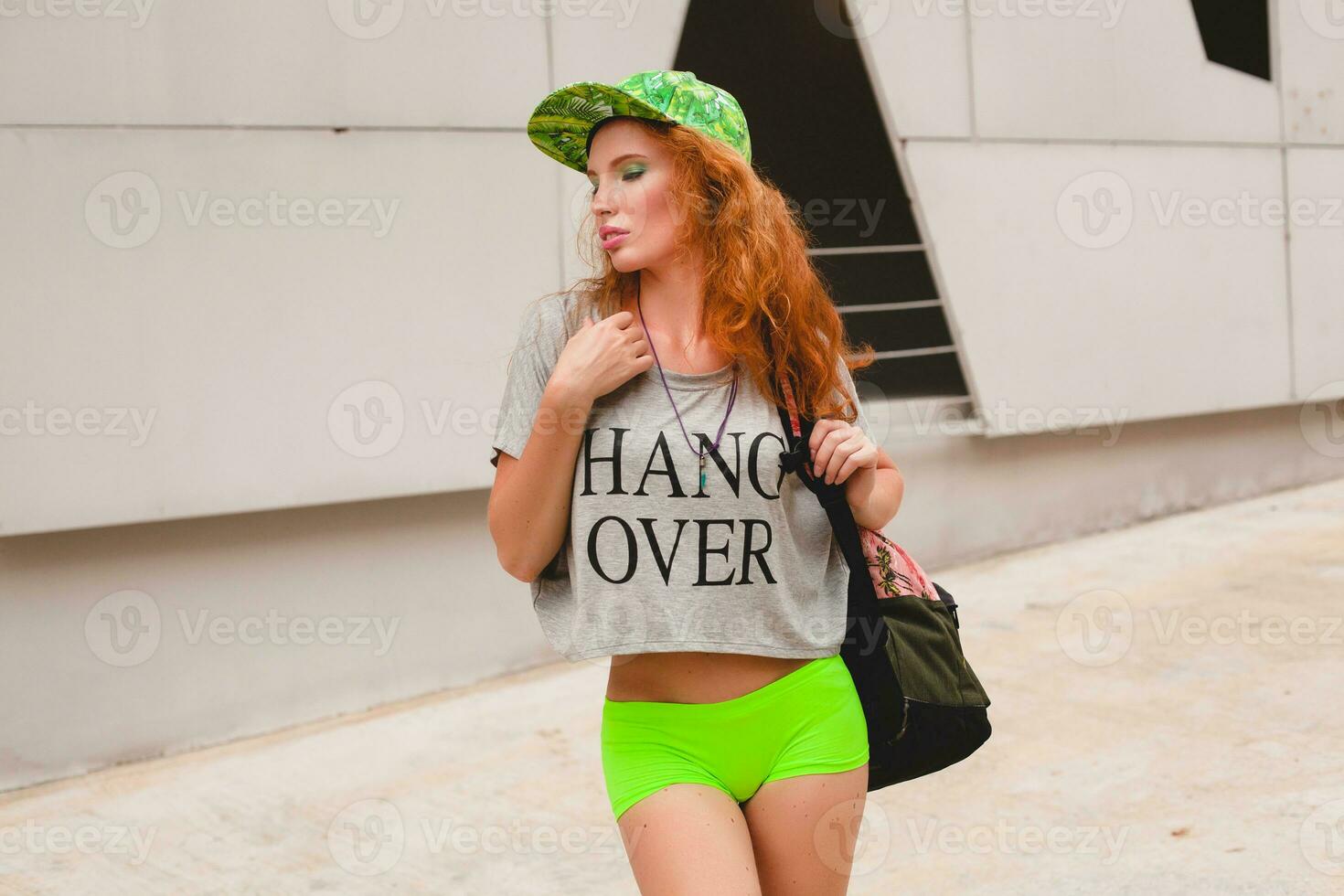 young stylish hipster ginger woman, walking in street photo