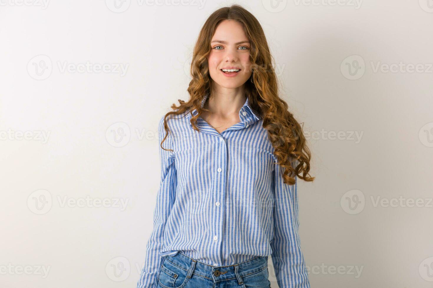 portrait of curly pretty young woman with blond culry long hair photo