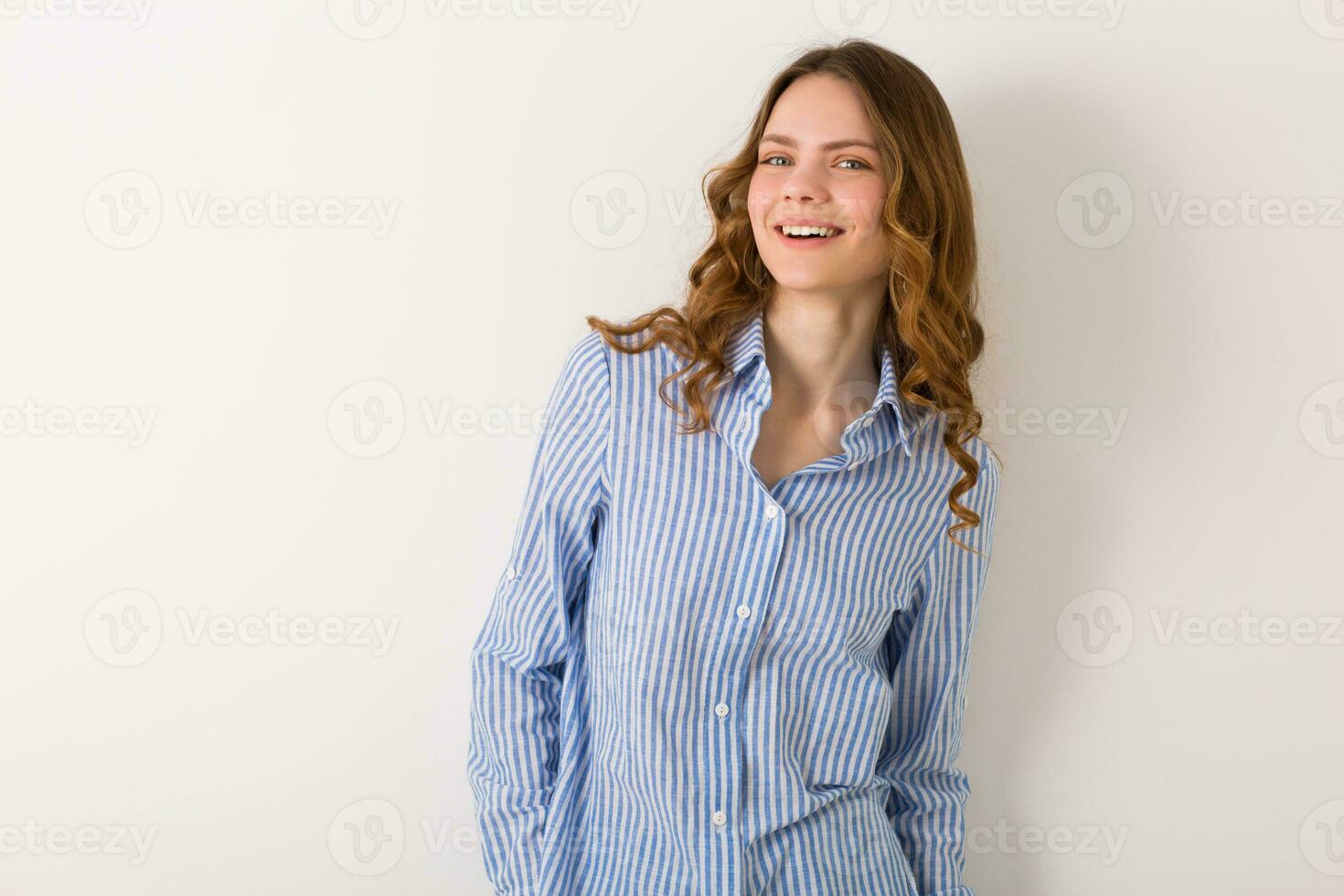 close up portrait of young natural pretty woman with curly haistyle photo