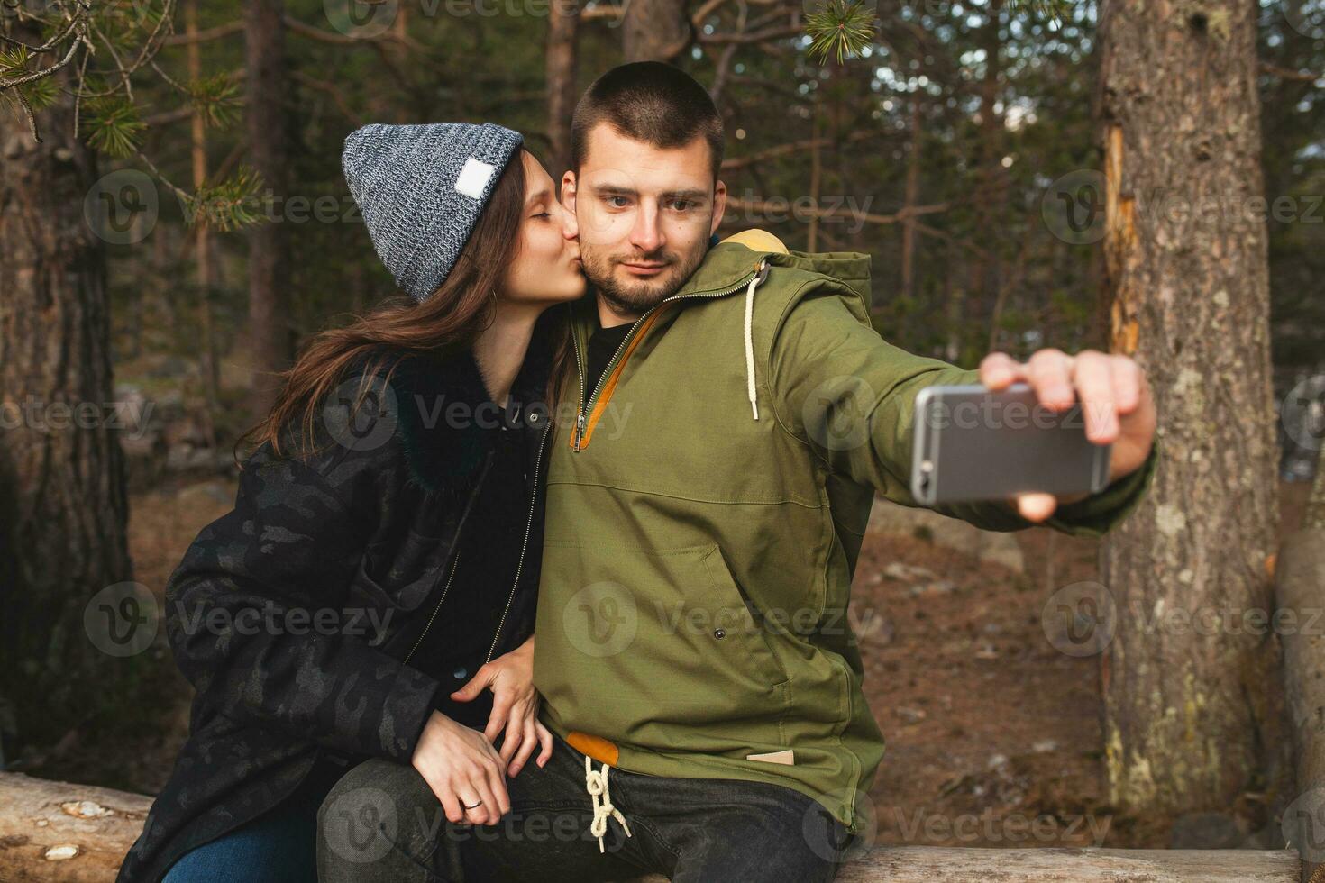 young beautiful hipster couple hiking in mountains photo