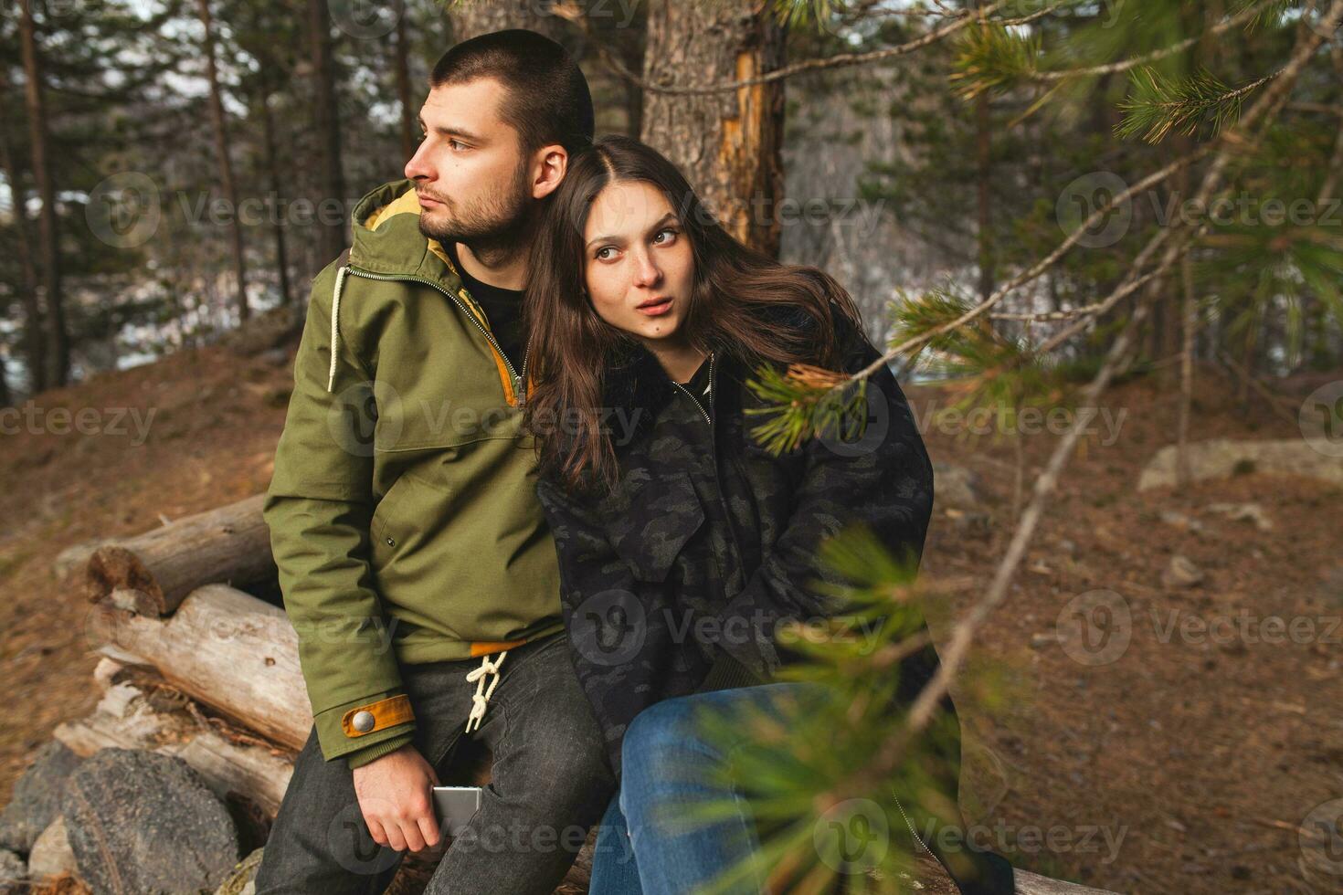 young beautiful hipster couple hiking in mountains photo