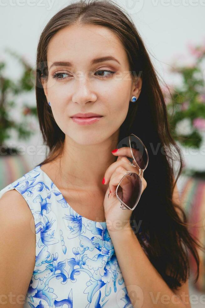 young stylish beautiful woman in blue printed dress summer style photo
