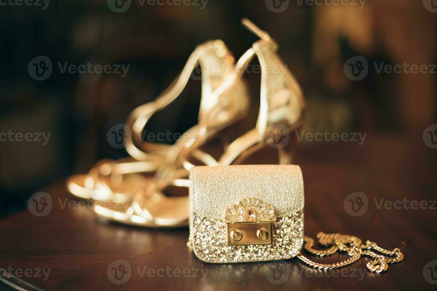 luxury fashion woman accessories, golden heeled shoes photo