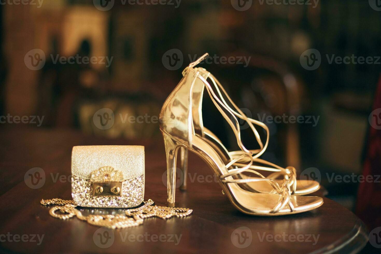 luxury fashion woman accessories, golden heeled shoes photo