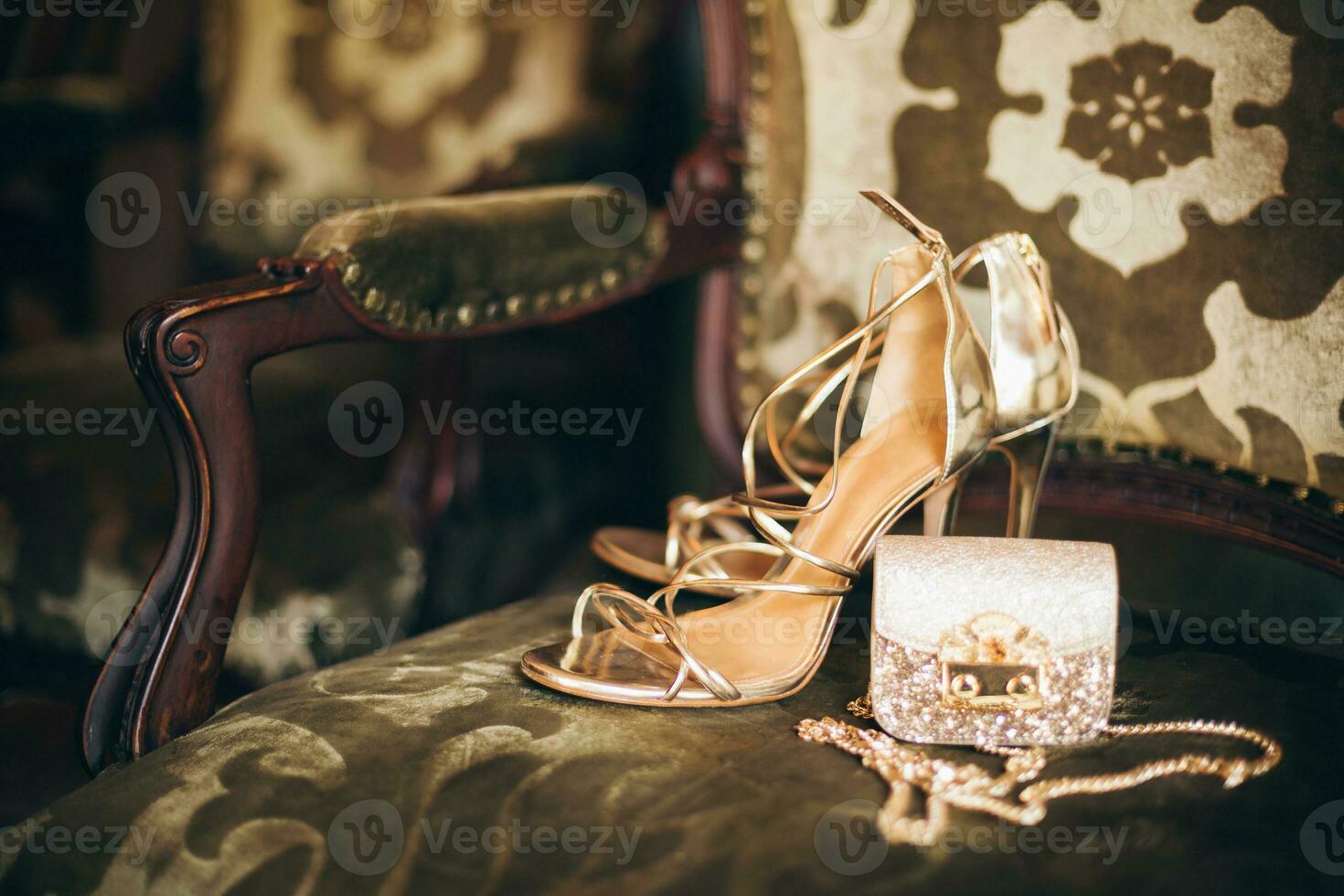 luxury fashion woman accessories, golden heeled shoes photo