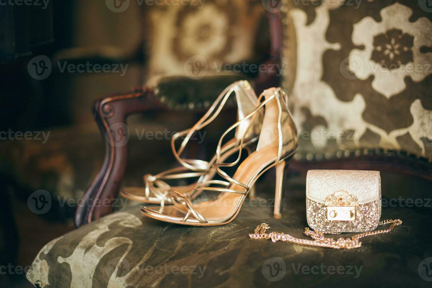 luxury fashion woman accessories, golden heeled shoes photo