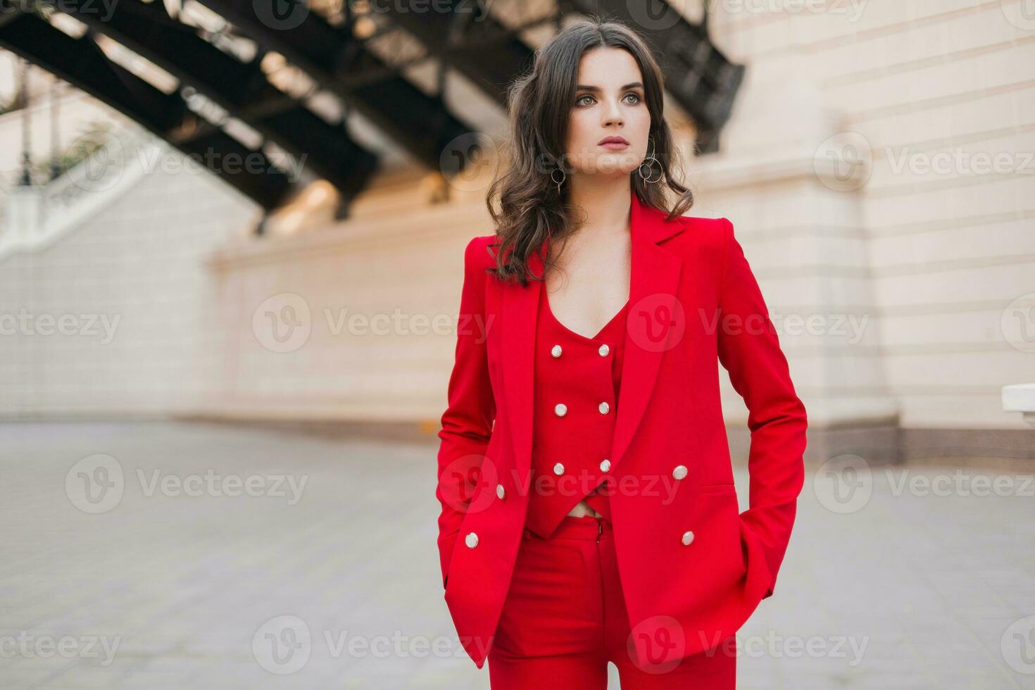 beautiful sexy rich business style woman in red suit walking in city street, spring summer fashion trend photo