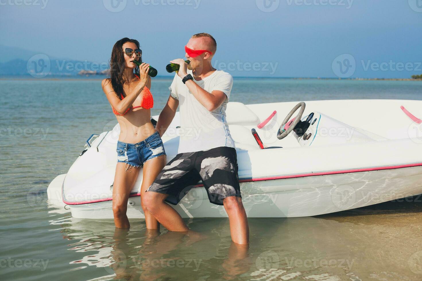 happy hipster woman and man on summer tropical vacation photo