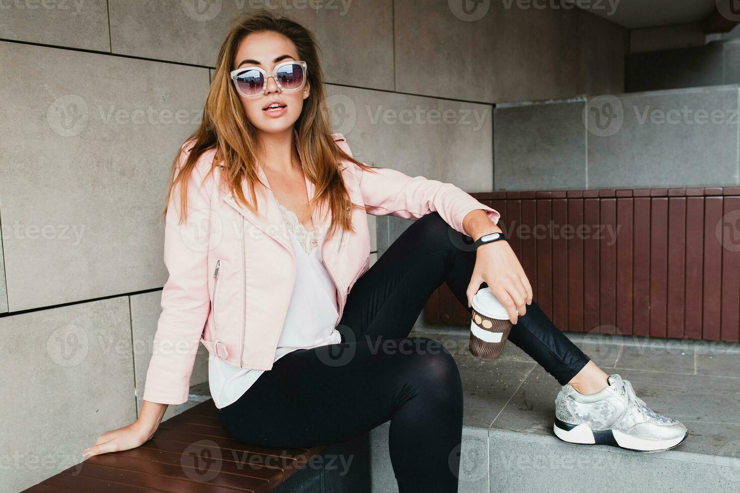 young beautiful stylish hipster woman in pink leather jacket photo