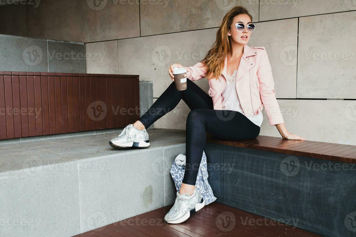 young beautiful stylish hipster woman in pink leather jacket photo