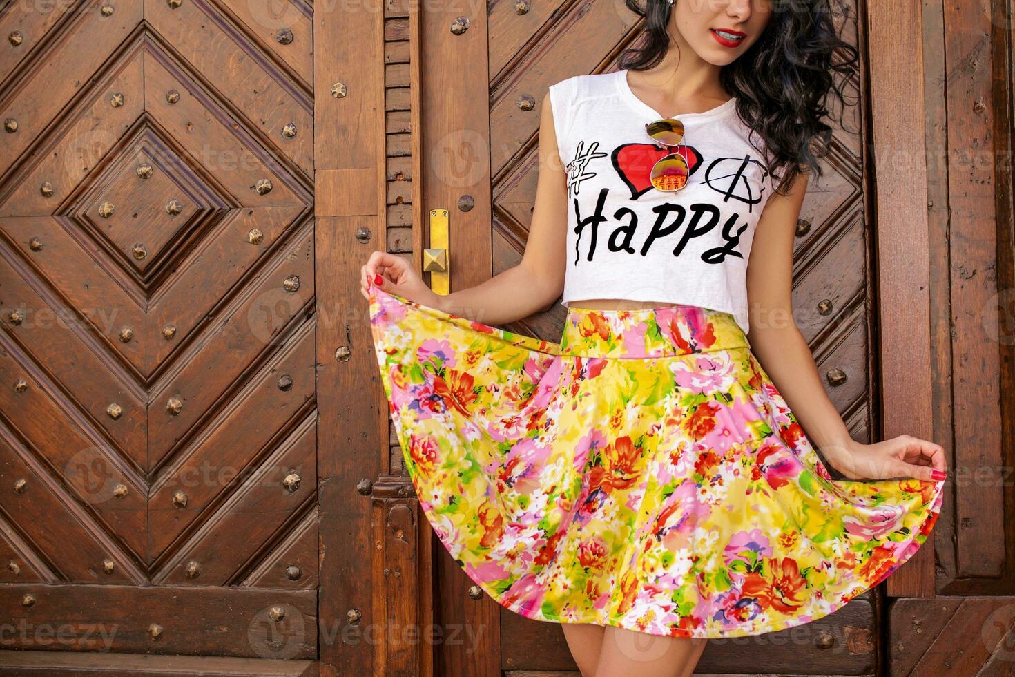 young beautiful hipster woman walking on old city street photo