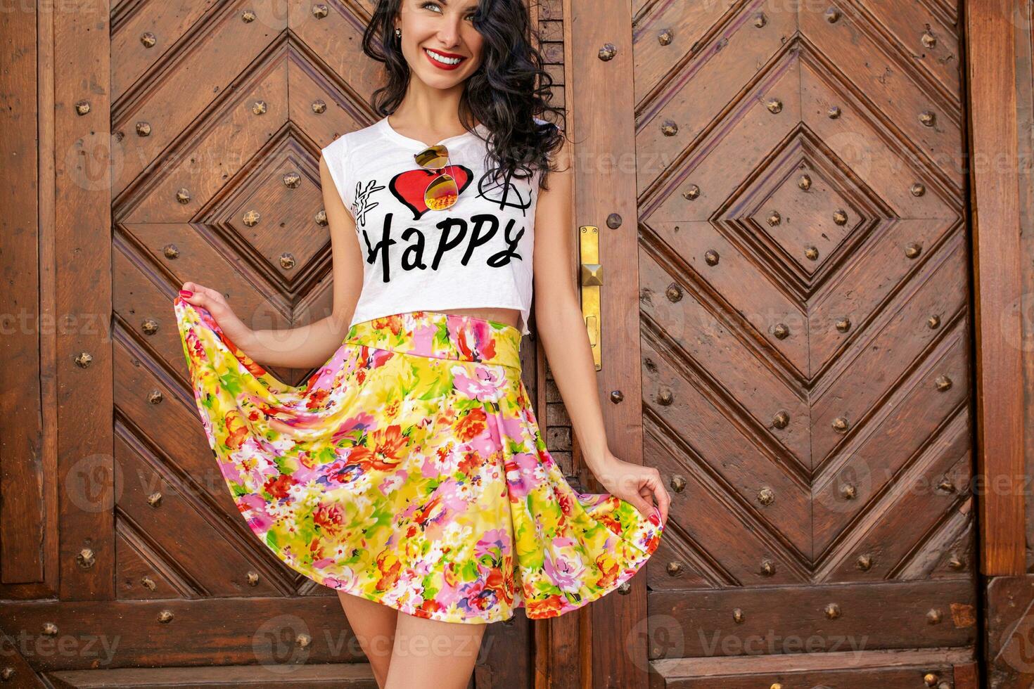 young beautiful hipster woman walking on old city street photo