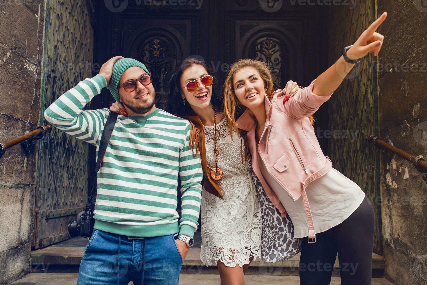 young hipster company of friends traveling, vintage style, europe vacation photo