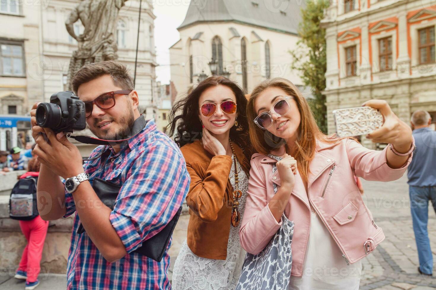 young hipster company of friends traveling, vintage style, europe vacation photo