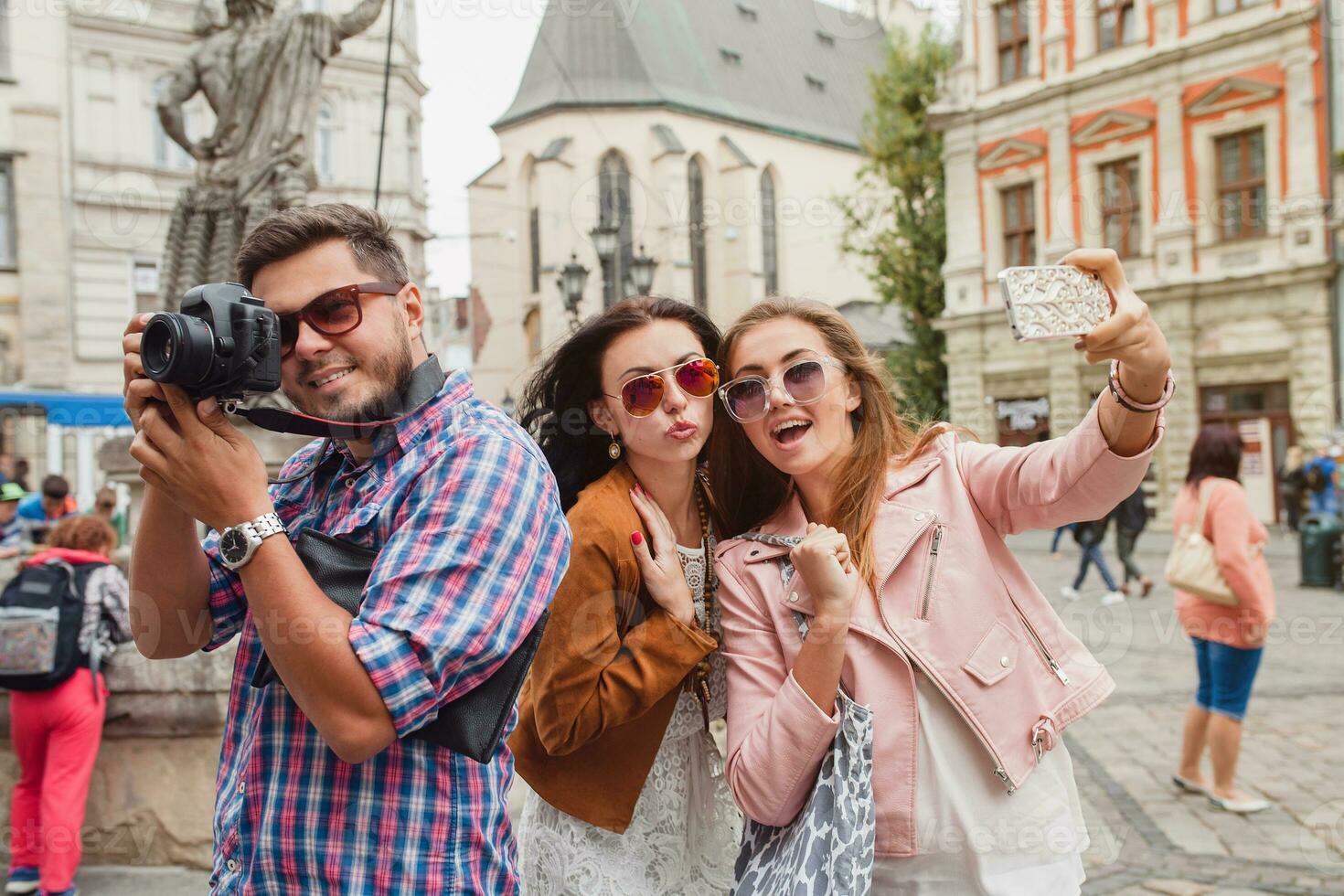 young hipster company of friends traveling, vintage style, europe vacation photo