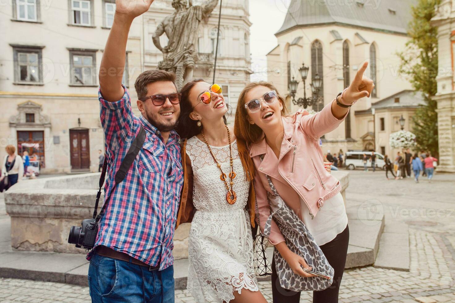 young hipster company of friends traveling, vintage style, europe vacation photo