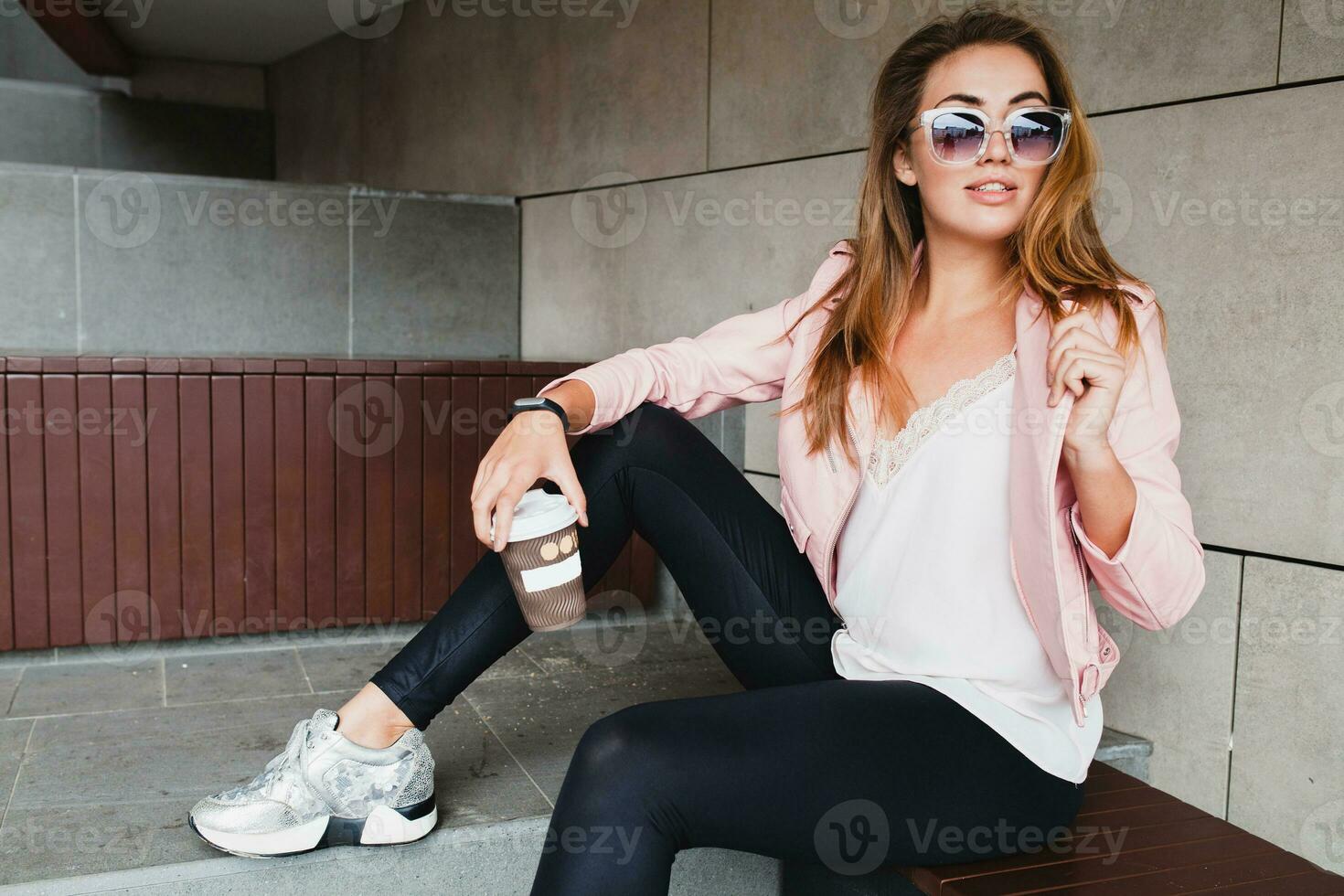 young beautiful stylish hipster woman in pink leather jacket photo